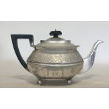 A good Georgian bright cut silver teapot decorated