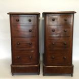 A pair of mahogany bedside chests with hinged fron