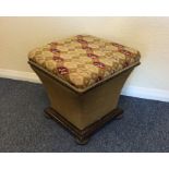 An upholstered footman with hinged tapestry top. E