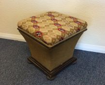 An upholstered footman with hinged tapestry top. E