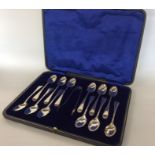 A boxed set of twelve Edwardian silver teaspoons t