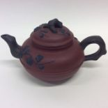 A Chinese Yixing redware oviform teapot and cover