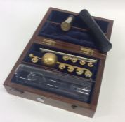A cased set of brass mounted scales together with