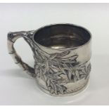 A Chinese silver tapering cup of typical design. A