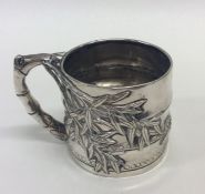 A Chinese silver tapering cup of typical design. A