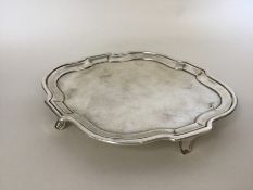 A Georgian oval silver teapot stand with wavy edge