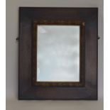 An attractive oak framed mirror decorated with gil