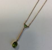 An attractive peridot drop pendant on fine link ch