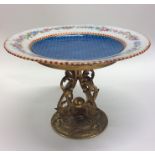 An attractive enamel plate on gilded stand and scr