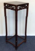 A good large Chinese hardwood stand with scroll de