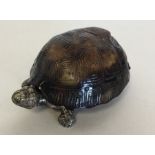 An unusual vesta case in the form of a tortoise wi
