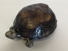 An unusual vesta case in the form of a tortoise wi