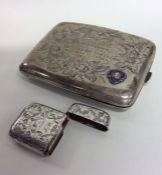 A heavy silver enamel decorated cigarette box toge