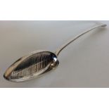 A George III silver straining spoon. London 1781.