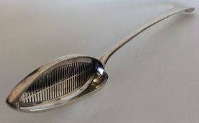 A George III silver straining spoon. London 1781.