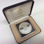 A silver Bahamas Anniversary $10 coin in case. Est