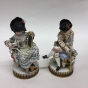 A pair of brightly coloured Meissen figures of sea
