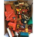 A box containing Dinky, Matchbox and other cars to