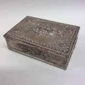 A large embossed silver plated cigarette box decor