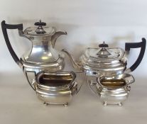 A heavy silver four piece tea service on ball feet