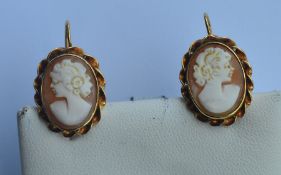 A pair of oval cameo earrings of rope twist design