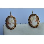 A pair of oval cameo earrings of rope twist design