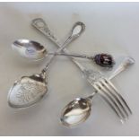 A silver christening fork together with a preserve