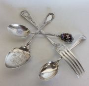 A silver christening fork together with a preserve