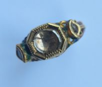 An Antique Indian enamel decorated gold ring inset