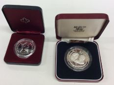 Three Royal Mint Proof coins in fitted boxes. Est.