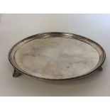 A good Georgian circular silver waiter on ball fee