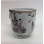 A Chinese coffee cup decorated with figures and gi