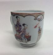 A Chinese coffee cup decorated with figures and gi