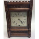 An Edwardian mantle clock with silvered dial in wa