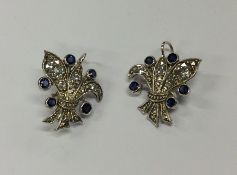 A pair of sapphire and diamond drop earrings in th