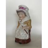 An unusual toby jug in the form of a lady in seate