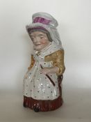 An unusual toby jug in the form of a lady in seate