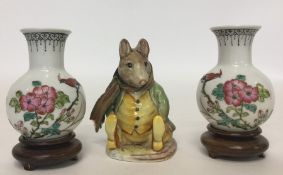 A small Beswick figure of Samuel Whiskers, togethe