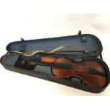 A cased violin together with a bow. Est. £20 - £30