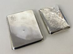 A heavy silver curved cigarette case together with