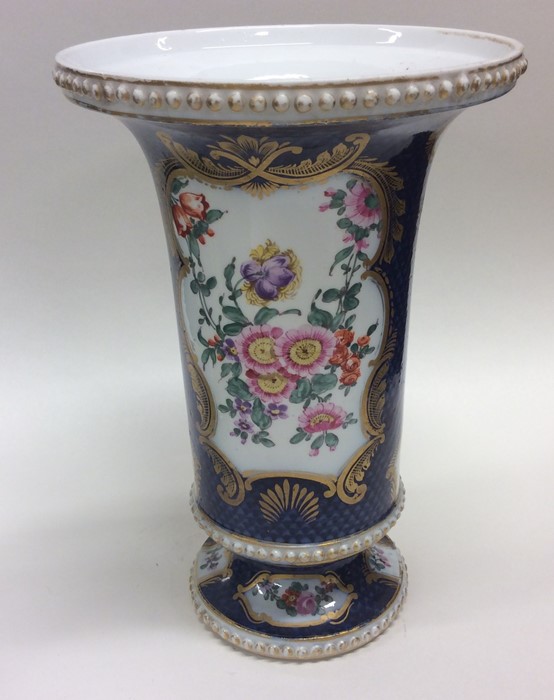 An attractive Continental vase decorated with flow