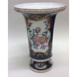 An attractive Continental vase decorated with flow