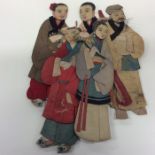 A group of five Asian puppets in bright colours. E