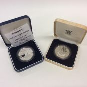 A Royal Mint Proof silver coin together with anoth