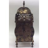 A large brass lantern clock of typical design with