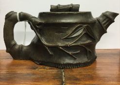 An unusual small simulated bamboo pottery teapot.