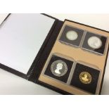A cased set of four Mountbatten coins to include 1