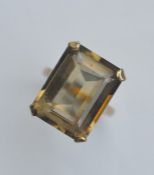 A large gold single stone ring in claw mount. Appr