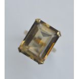 A large gold single stone ring in claw mount. Appr