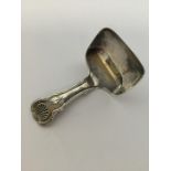 A small kings' pattern silver caddy scoop. Birming